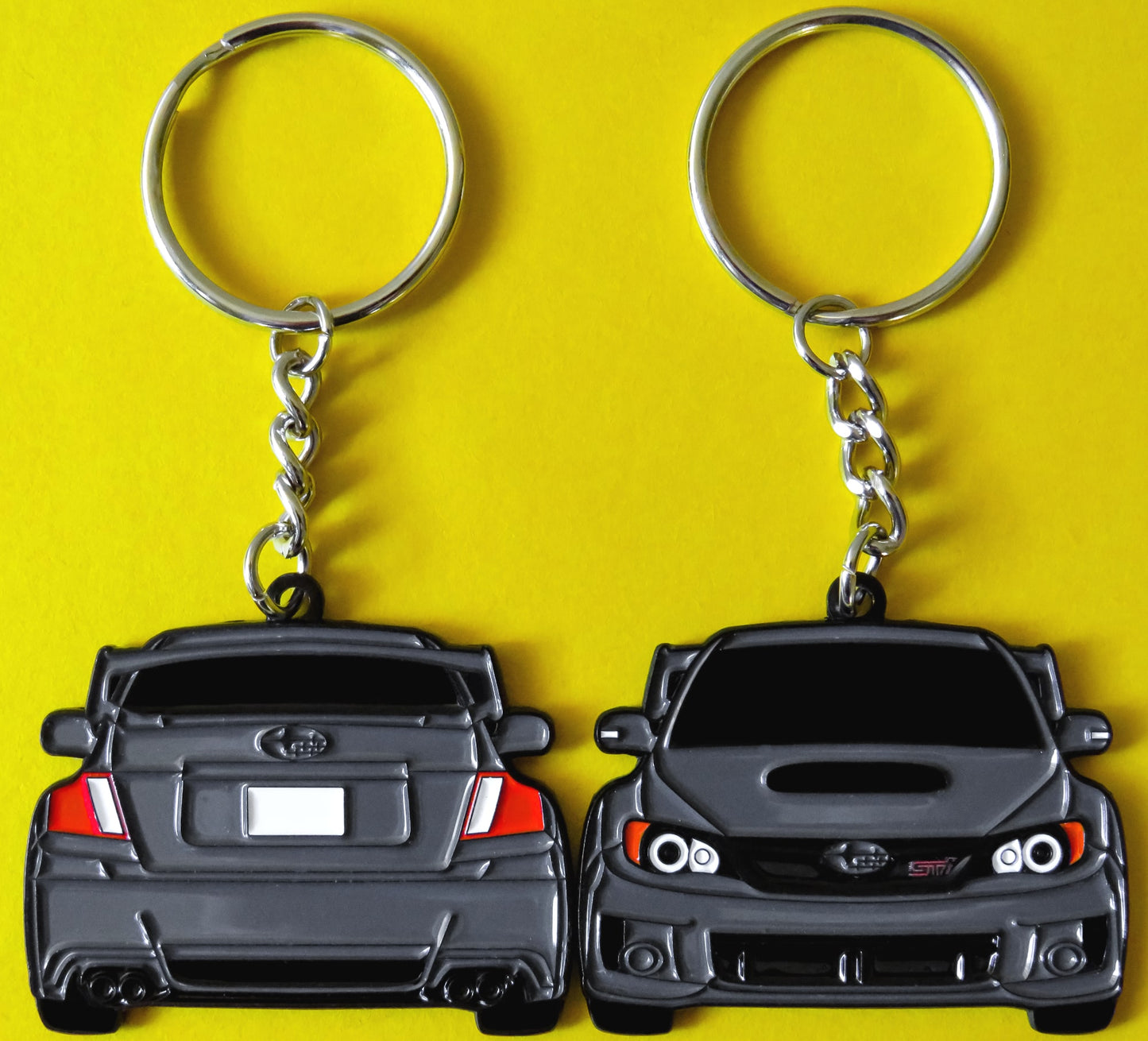 Subaru WRX STI 2-Sided Gray Keychain that fits on a key fob, Precision-Crafted Design, Ideal for WRX STI Enthusiasts, Rally Car Lovers, and Automotive Fans. Elevate Your Keys with WRX STI Style and Unmatched Performance, A Must-Have Accessory for Subaru WRX STI Owners. A great gift for owners, fans, him, her, boyfriend, girlfriend, mom, dad, father, mother, and more!