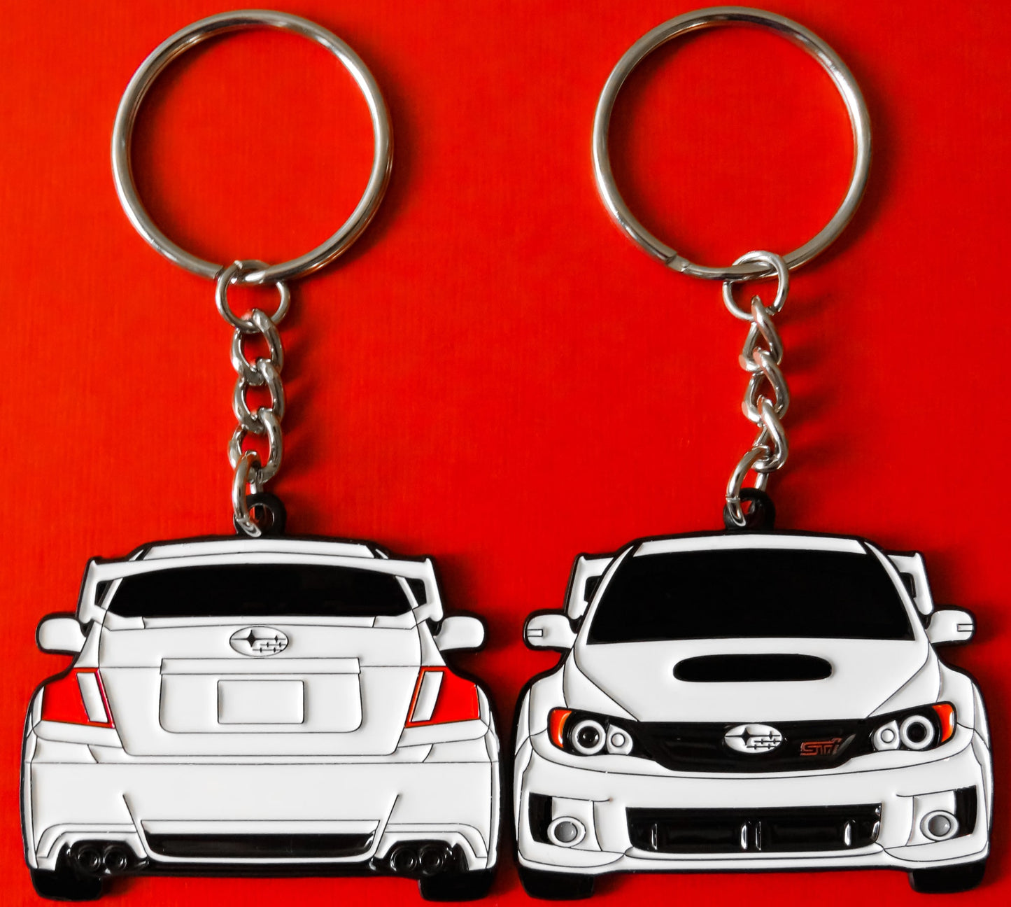 White Subaru WRX STI 2-Sided Keychain that fits on a key fob, Precision-Crafted Design, Ideal for WRX STI Enthusiasts, Rally Car Lovers, and Automotive Fans. Elevate Your Keys with WRX STI Style and Unmatched Performance, A Must-Have Accessory for Subaru WRX STI Owners. A great gift for owners, fans, him, her, boyfriend, girlfriend, mom, dad, father, mother, and more!