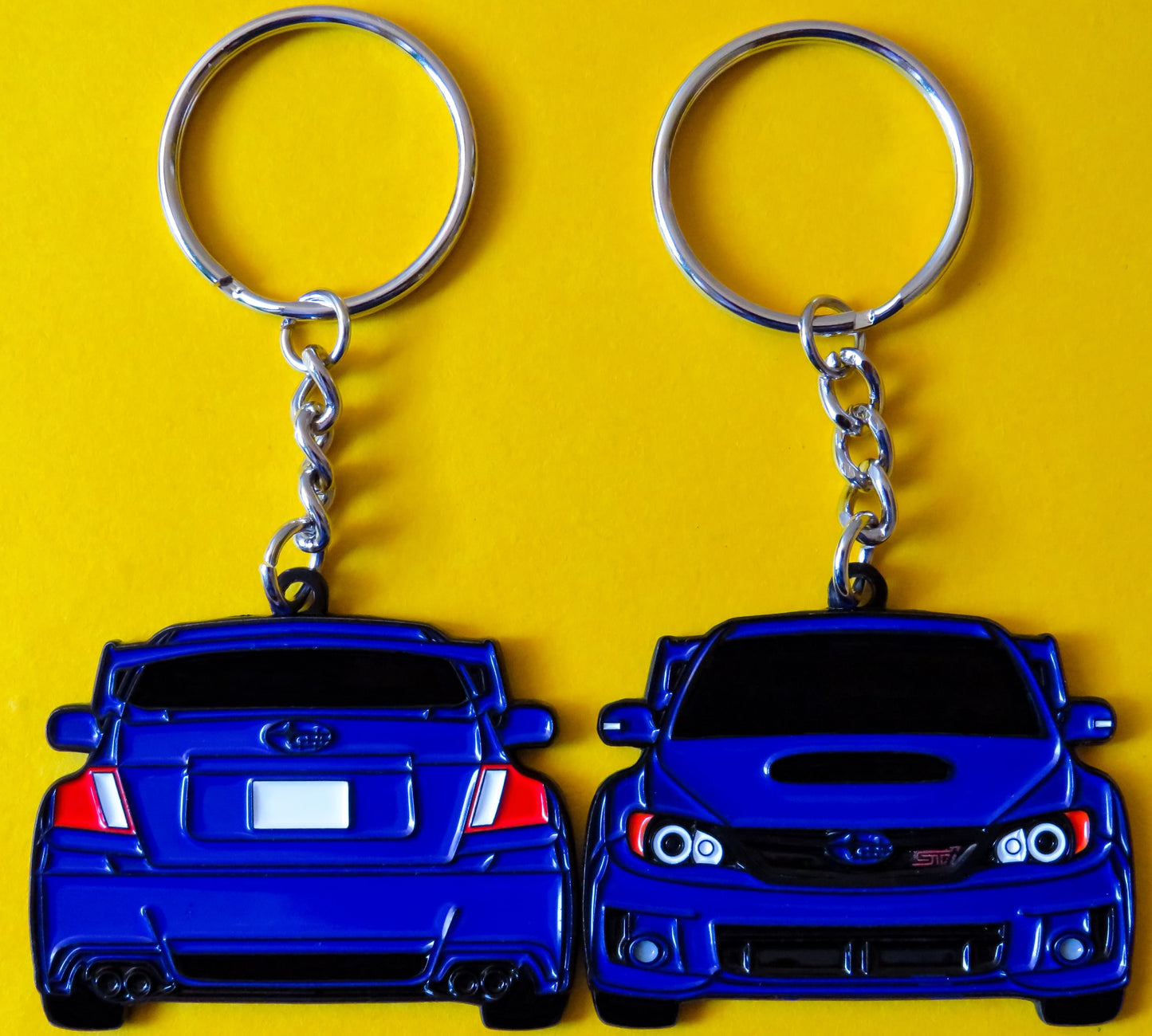 Blue Subaru WRX STI 2-Sided Keychain that fits on a key fob, Precision-Crafted Design, Ideal for WRX STI Enthusiasts, Rally Car Lovers, and Automotive Fans. Elevate Your Keys with WRX STI Style and Unmatched Performance, A Must-Have Accessory for Subaru WRX STI Owners. A great gift for owners, fans, him, her, boyfriend, girlfriend, mom, dad, father, mother, and more!
