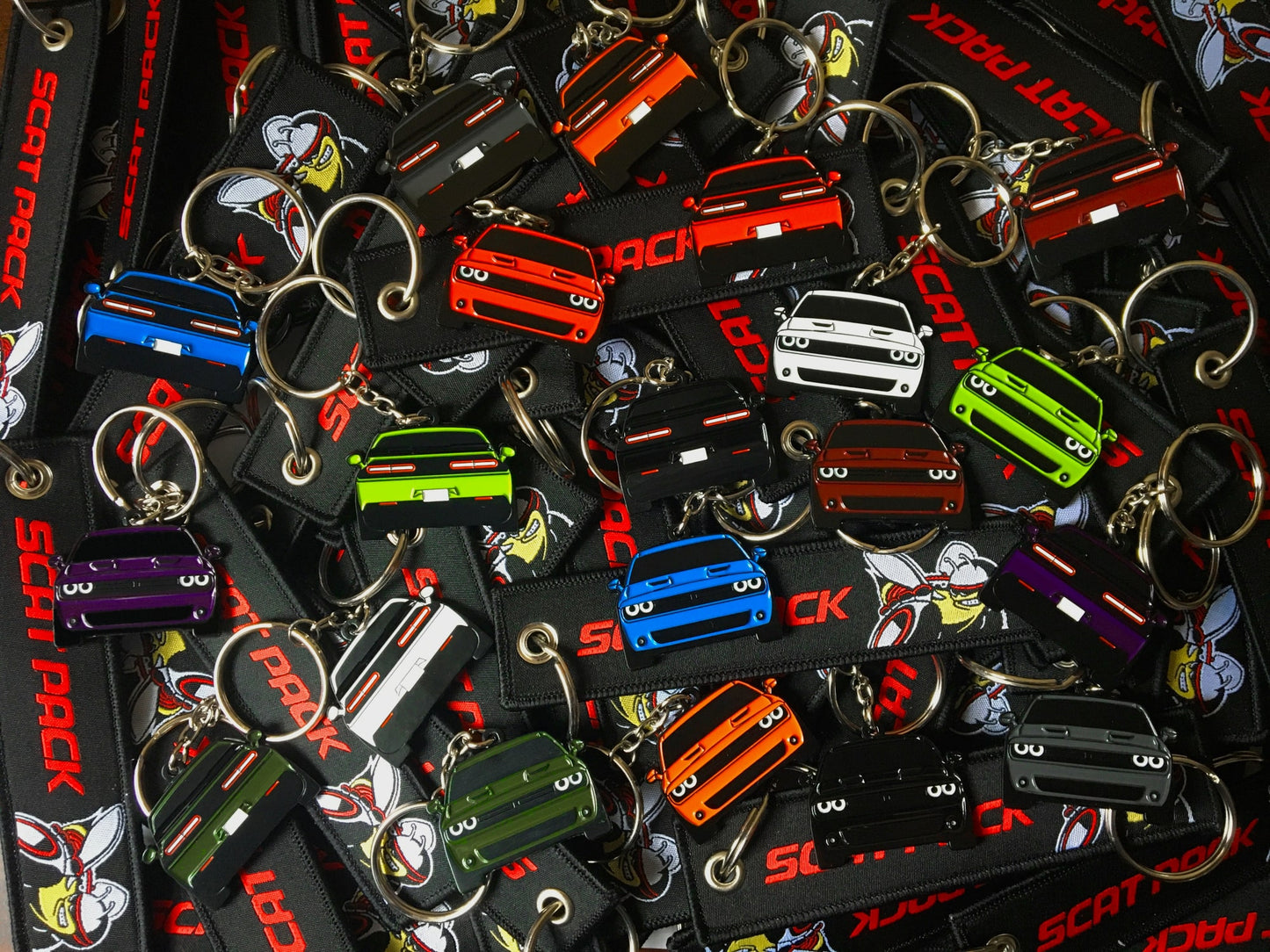 Keychain that fits on a key fob cover For Challenger Scatpack In Orange, key ring gift idea for car guys, car enthusiasts, gearheads, petrolhead, gearhead, and more. Gifts for boyfriend, girlfriend, mother, father, brother, sister, him, her, mom, dad and much more. Scat pack jet tag double sided. 392 and 345 hemi or SRT, RT, and R/T.