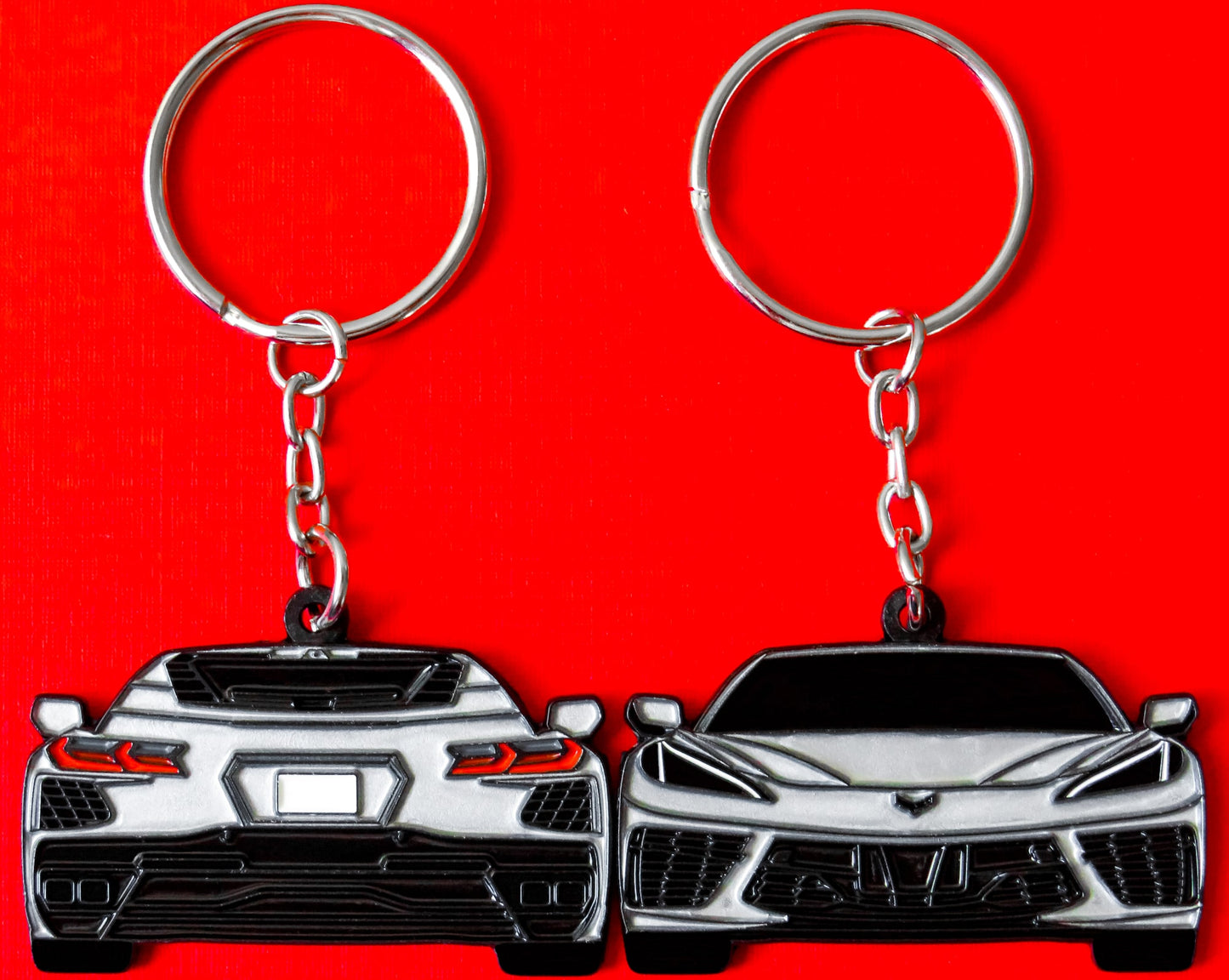 Silver Chevrolet Chevy C8 Corvette Stingray Z06 ZR1 Keychain Gift For Car Enthusiasts, Car Guys, Gearheads, Father, Dad, Mother, Mom, Boyfriend, Him, Girlfriend, Her, and more. American muscle car enamel pin patch unique gift idea. Jet tag key ring that fits on a key fob cover for Chevy owners and fans
