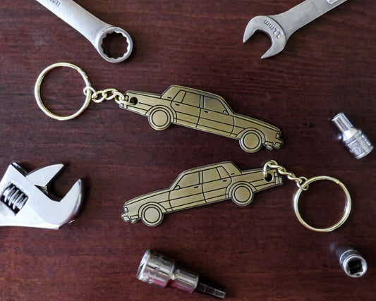 Cool Silhouette Keychain For A Classic Box Chevy Caprice Brougham Donk Lowrider. Great gift for husband mother father dad mom him her boyfriend girlfriend along with car enthusiasts fans and owners. Fits on a key fob and also works well as a keyring and lanyard emblem