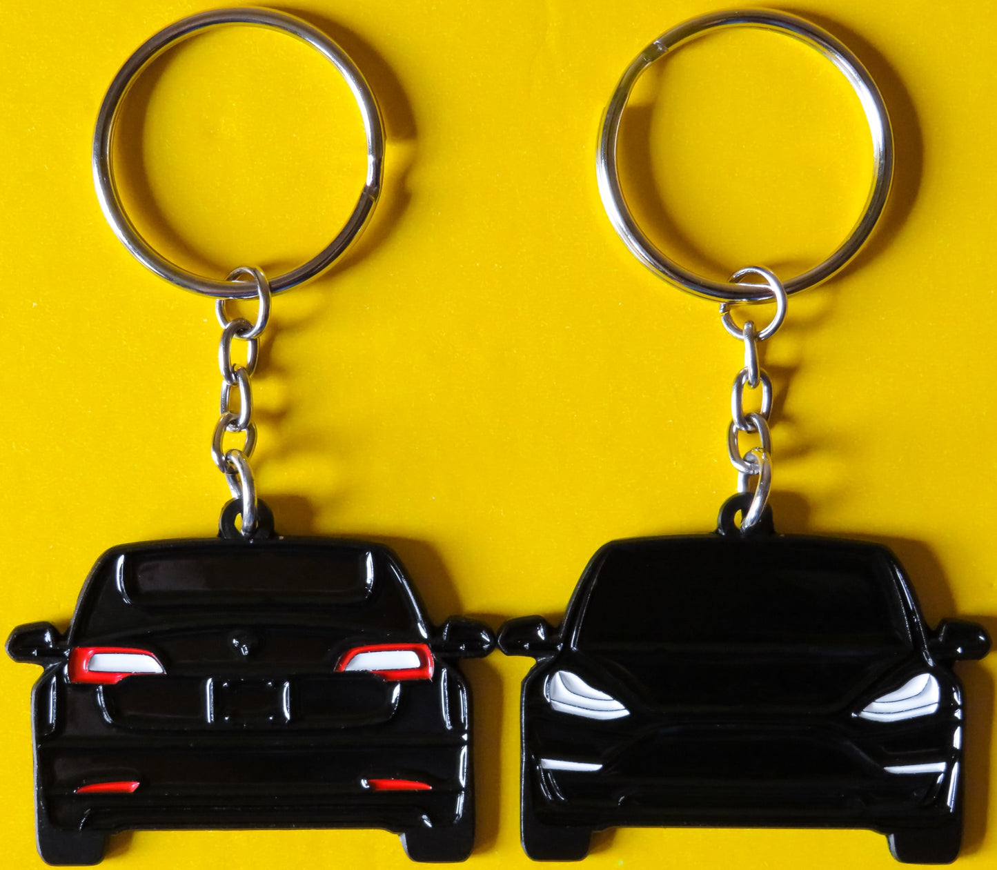 Enamel Keychain Pin Patch Lanyard that fits on a key fob cover for Tesla Model 3. A great accessory for EV owners and enthusiasts along with accessories, jet tag, key ring gift ideas for car guys, car enthusiasts, gearheads, father, mother, dad, mom, him, her, boyfriend, girlfriend and more.