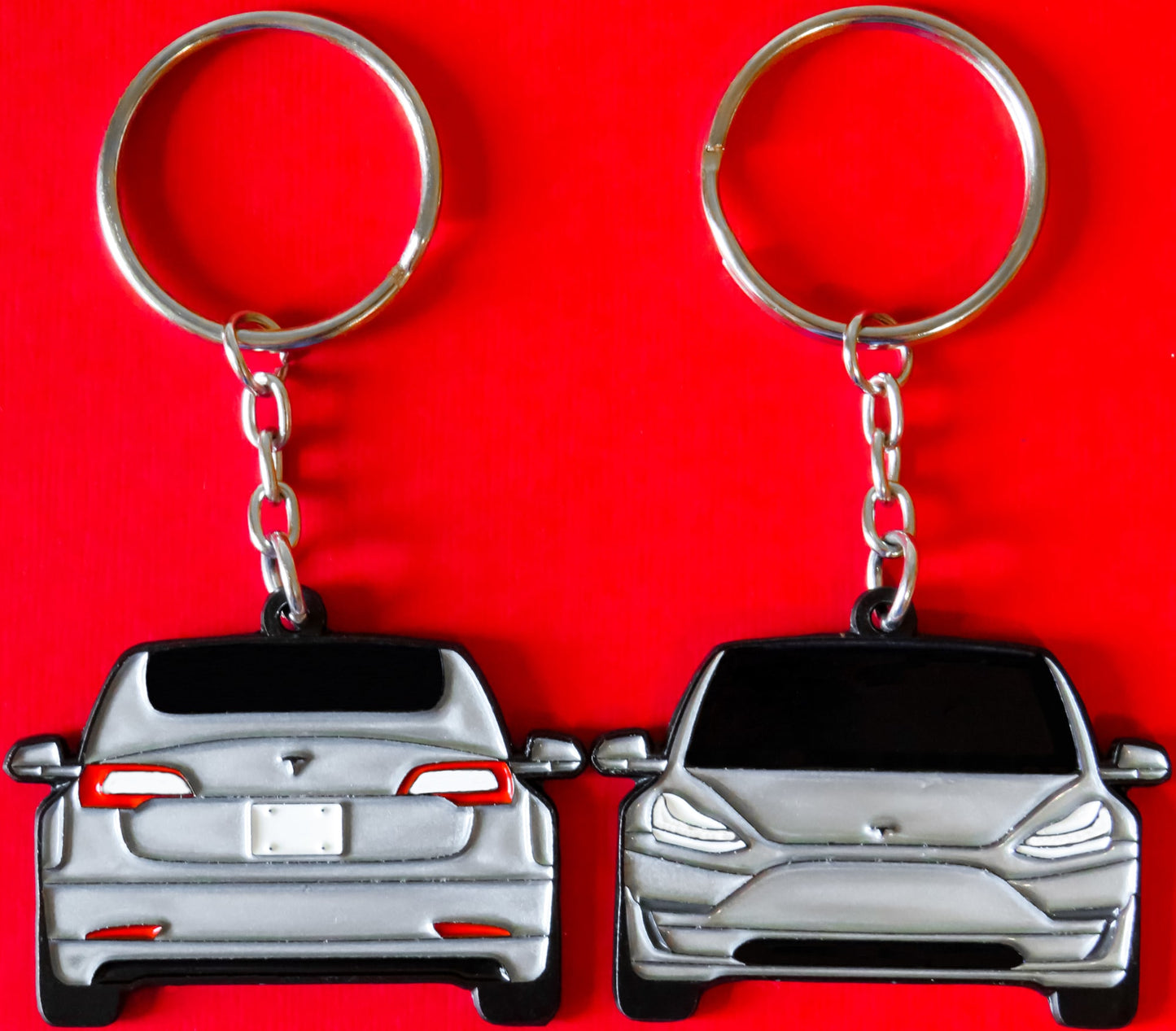 Enamel Keychain Pin Patch Lanyard that fits on a key fob cover for Tesla Model 3. A great accessory for EV owners and enthusiasts along with accessories, jet tag, key ring gift ideas for car guys, car enthusiasts, gearheads, father, mother, dad, mom, him, her, boyfriend, girlfriend and more.