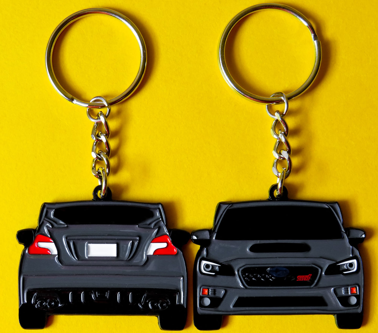 Gray Subaru WRX STI 2-Sided Keychain that fits on a key fob, Precision-Crafted Design, Ideal for WRX STI Enthusiasts, Rally Car Lovers, and Automotive Fans. Elevate Your Keys with WRX STI Style and Unmatched Performance, A Must-Have Accessory for Subaru WRX STI Owners. A great gift for owners, fans, him, her, boyfriend, girlfriend, mom, dad, father, mother, and more!